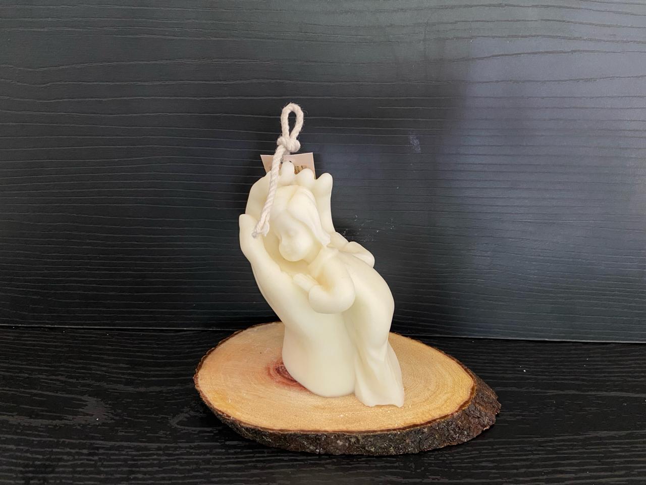 VELA NIÑO EN MANO